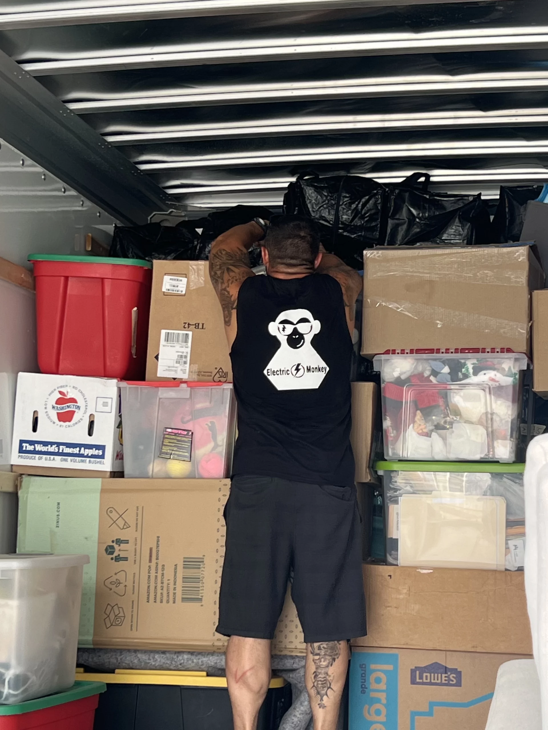 moving and stacking boxes in the back of a moving van