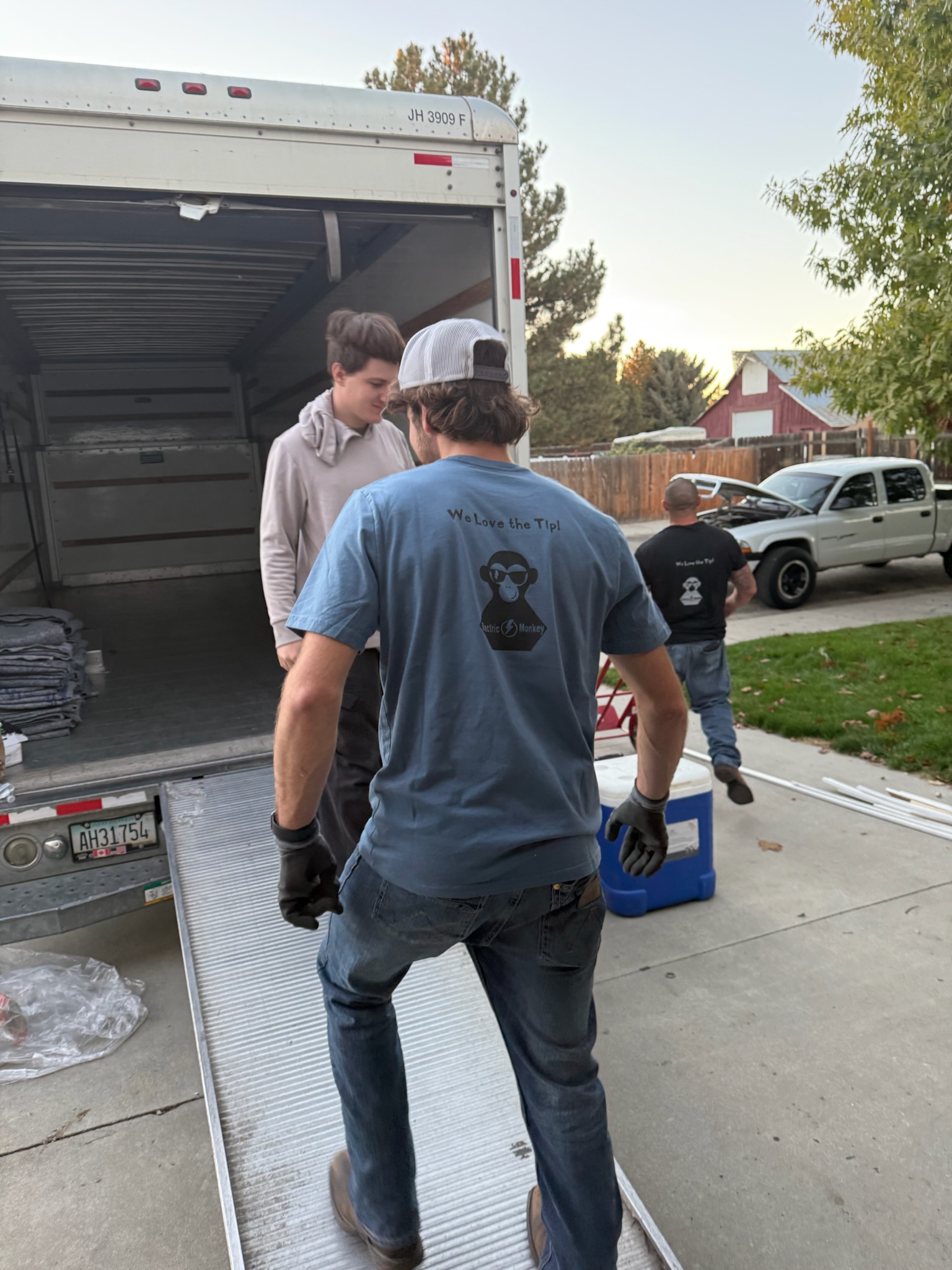 guys walking onto a moving truck