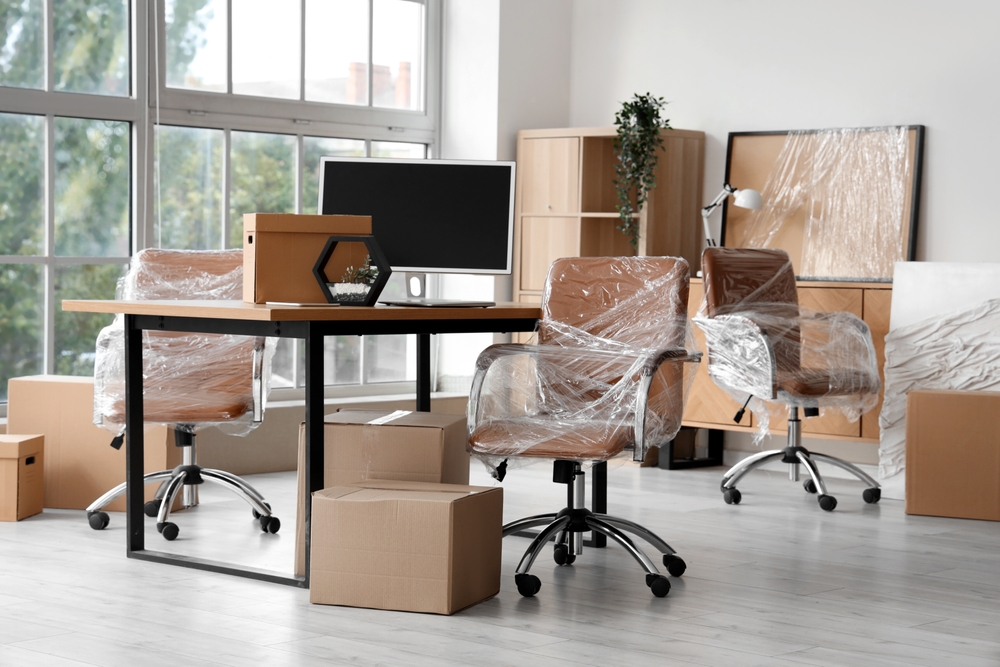 Interior,of,modern,office,with,chairs,wrapped,in,stretch,film